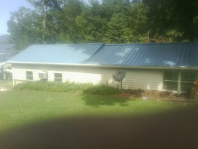 Blue metal roof running the length of a single story home in Forks Of Salmon